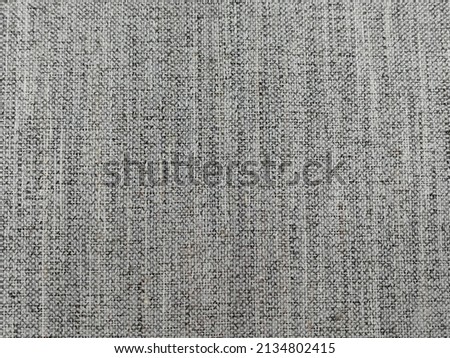Flat grey canvas hair fabric texture background. This fabric is made of 100% canvas hair.