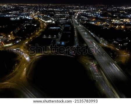 Night aerial view of the Black Country and Birmingham UK with motorway traffic