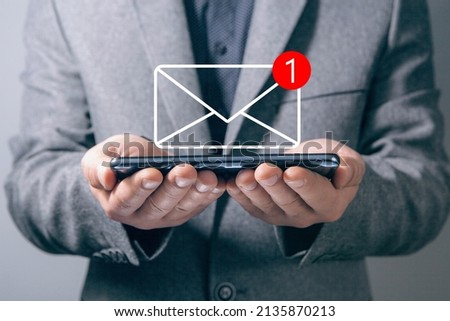 new message notifications. man holding phone