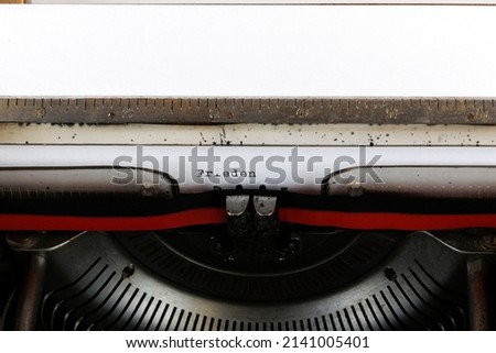 The German word Frieden written on an old mechanical typewriter German Text: peace