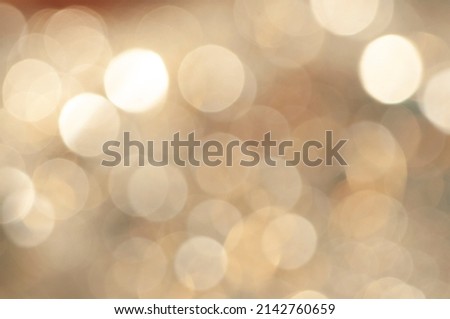 Abstract golden background with smooth bokeh, abstract defocused golden background with golden shapes ideal for wallpaper, graphic design and film making