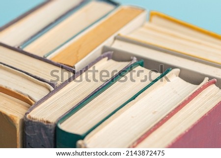 Old vintage books on the light blue background. World Book Day. Copy space. Education concept