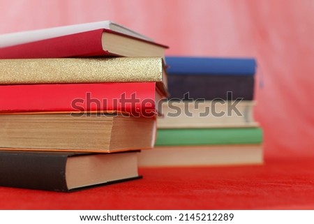 School books on red background