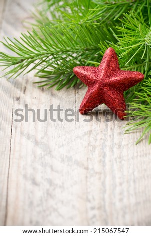 Spruce twigs on a wooden background, photo studio.
