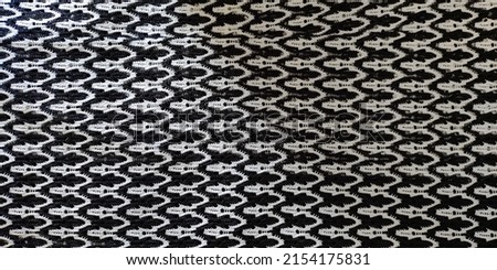 Detail fabric with unique pattern and black white colors. Can be used as background.
