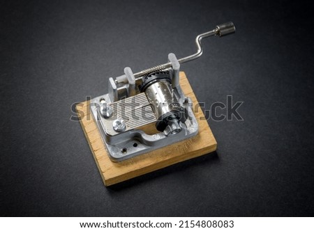 Traditional music box isolated on black background