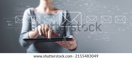 Email concept with business woman using a tablet computer