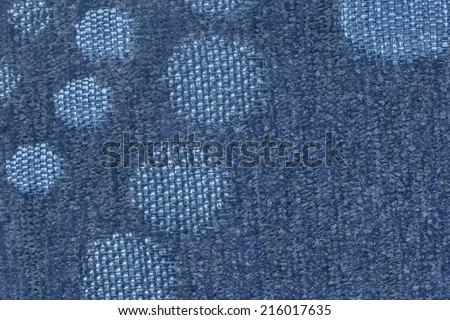 Photograph of dark Marine Blue woven Acrylic Polyethylene upholstery and drapery fabric, with decorative circular pattern, detail.