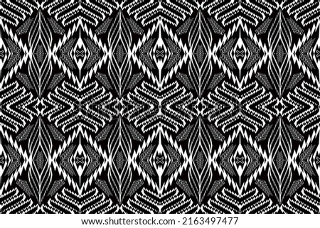 Ikat geometric folklore ornament with diamonds. Tribal ethnic vector texture. Seamless striped pattern in Aztec style. Folk embroidery. Indian, Scandinavian, Gypsy, Mexican, African rug Abstrack black