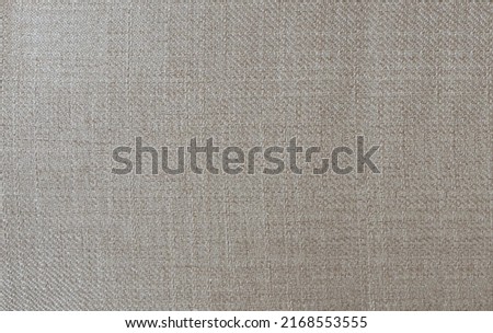 Dense fabric of coarse threads. Abstract gray with beige shade. Seamless pattern. Neutral textured backdrop for creative design.
