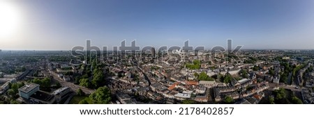 Broad horizon 360 degrees panoramic aerial view of the medieval Dutch city centre of Utrecht with cathedral towering over the city at early morning sunrise. Cityscape in The Netherlands