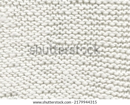  White sweater knitted texture top view. Cold weather white background top view.