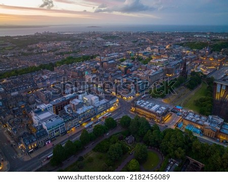 New Town and Scott Monument on Princes Street aerial view at sunset in Edinburgh, Scotland, UK. New town Edinburgh is a UNESCO World Heritage Site since 1995. 