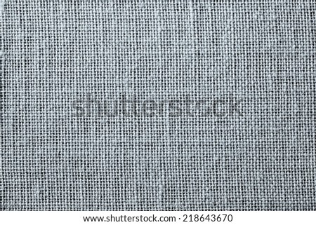 textile texture of rough silvery color fabric with a blank space for abstract backgrounds and for wallpaper