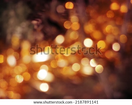 Golden background with abstract spots of light, photo toned, bokeh