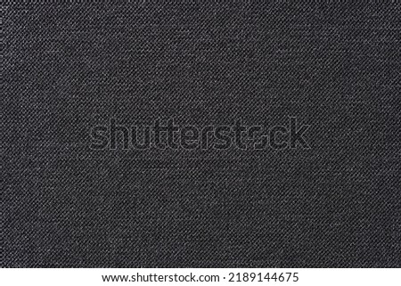 Top view of soft and smooth textile material textured background. Natural black fabric surface backdrop with copy space