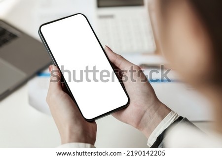 A Woman using cell phone screen. Blank screen for your advertising