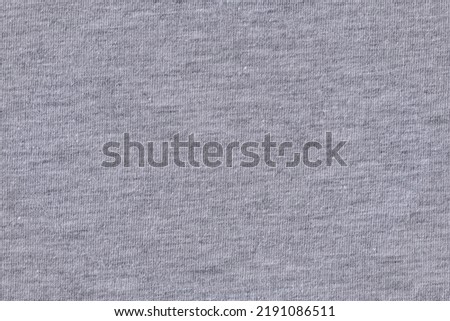 Gray cotton fabric, closeup macro detail of t shirt made into seamless tileable pattern, image width 20cm