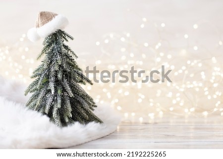 Christmas little trees and golden lights bokeh.
