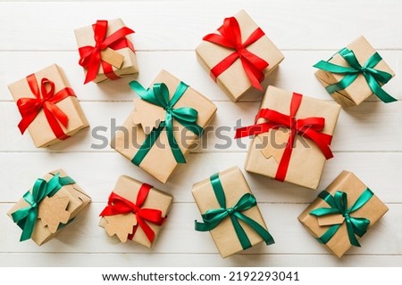 Colored craft gift boxes with colorful ribbons on colored background. Collection of present boxes.