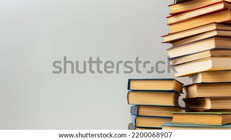 A tall pile of old books