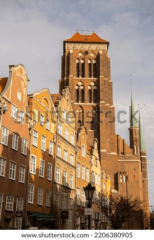 Gothic Bazylika Mariacka church Saint Mary cathedral in City hall Ancient architecture of old town in Gdansk Poland. Beautiful and colorful old houses historical part of downtown