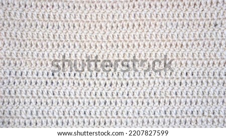 Crochet knitted stitched handmade soft tender wool fabric background texture surface wallpaper backdrop banner abstract 
