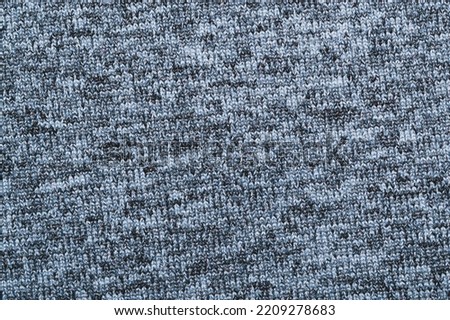Gray knitted texture. fabric close up. textile background