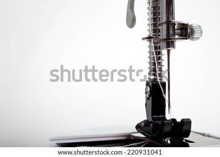 Sewing machine foot and needle close up 