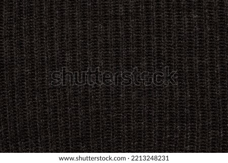 Close-up smooth abstract texture black color fabric cloth textile background, knitted wool material. Macro, web theme, template, wallpaper, concept design, for your design, in detail
