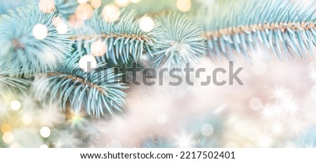 Closeup of Christmas tree background with christmas lights and snowflakes. New year holiday background