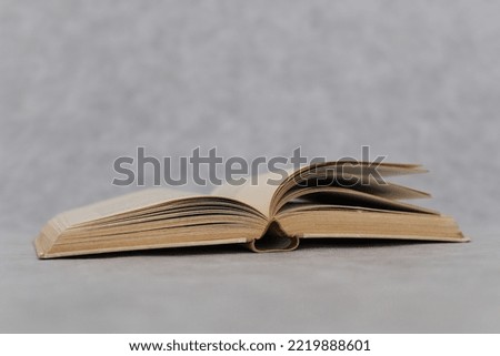 Open book on grey background