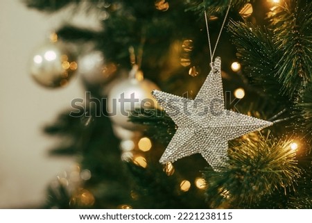 Decorated Christmas tree with silver ornaments. Merry Christmas and Happy New Year concept.