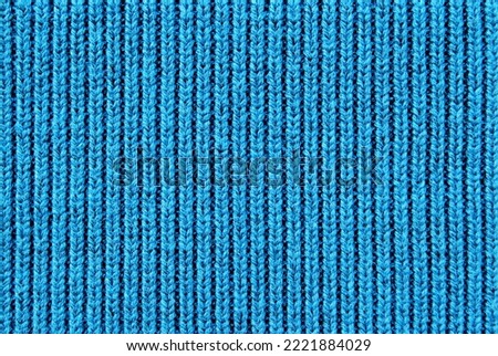 Soft blue color ribbed knit fabric pattern close up as background