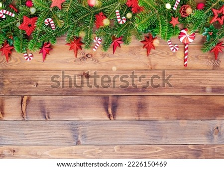Christmas background with fir branches, cones, snowflakes and decorations