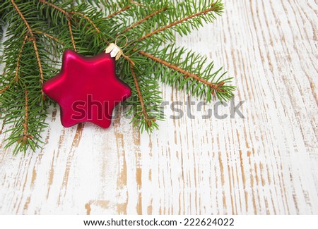 Green Pine tree branch with christmas bauble