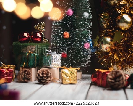 Christmas tree and gift box balls. Bokeh garlands in the blur background . cube block to contain the purpose of doing business overcoming. Developing ideas for the new year 2023	
