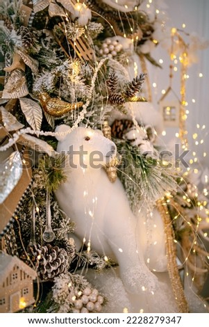 Cozy atmosphere of Christmas, holidays and New Year in the details of the interior of the Christmas room. Christmas decorations luxury close-up. The concept of a festive cozy home.