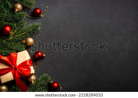 Christmas flat lay background with holiday decorations on black.