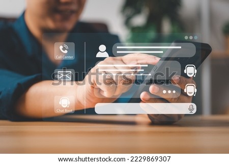 Person use customer service and support live chat with chatbot and automatic messages, Artificial intelligence, and CRM software technology. AI Chatbot smart digital customer service application.