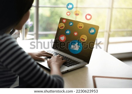 Close up asian woman using computer laptop addiction to technology trends following with emoji on social networks. surrounded by many icons, likes, hearts. Social medias and technology concept.