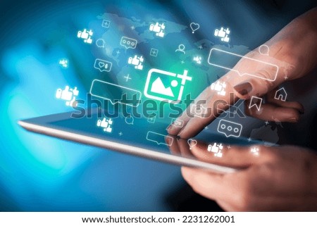 Close-up of a hand using tablet, social media concept