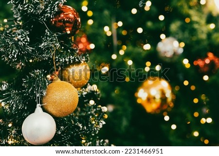 Close up Christmas tree and decorations on light bokeh and blurred background.Merry Christmas and New Year concept.
