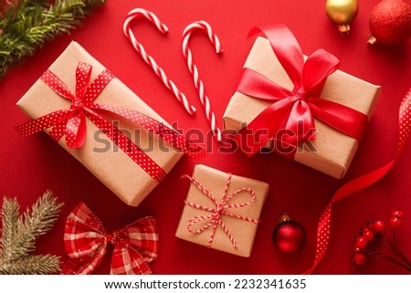 Christmas gifts, boxing day and traditional holiday presents flat lay, classic xmas gift boxes on red background, wrapped present with festive ornaments and decorations for holidays flatlay design