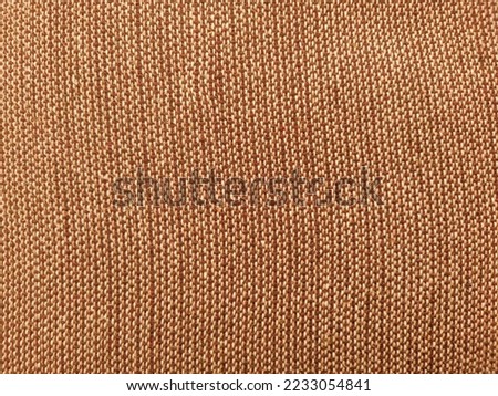 Brown cotton fabric texture. close up view.