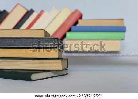stack of different books on wooden table_education concept
