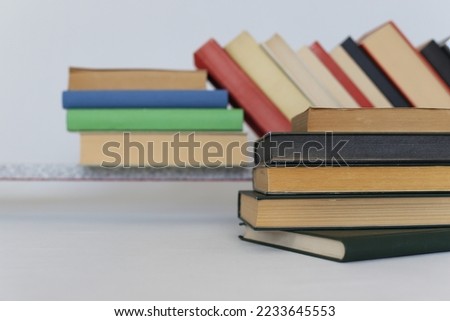 stack of different books on wooden table_education concept