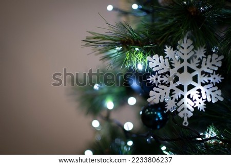 snowflake on christmas tree with lights