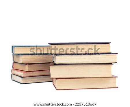 Two stacks of hardback books on a white background. Copy space.