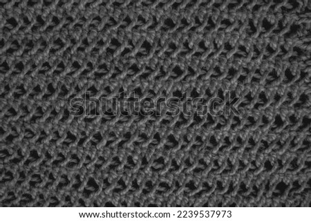Handmade knitting background with macro woven threads.